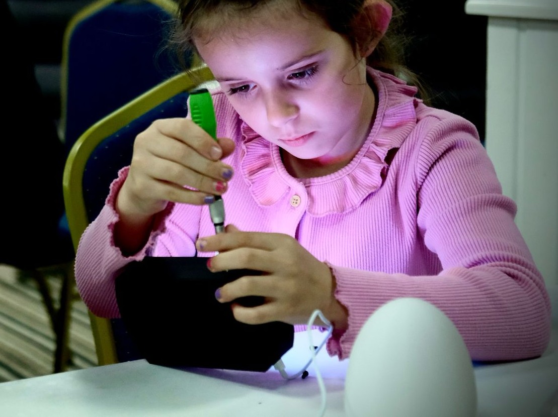 Girl testing her Easter Glow egg