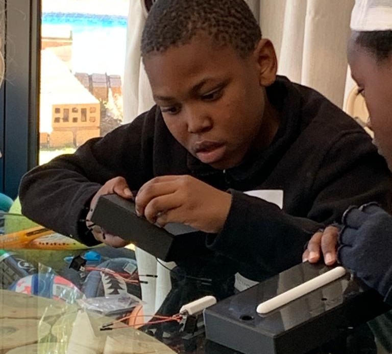 Boys building their Blink reaction games